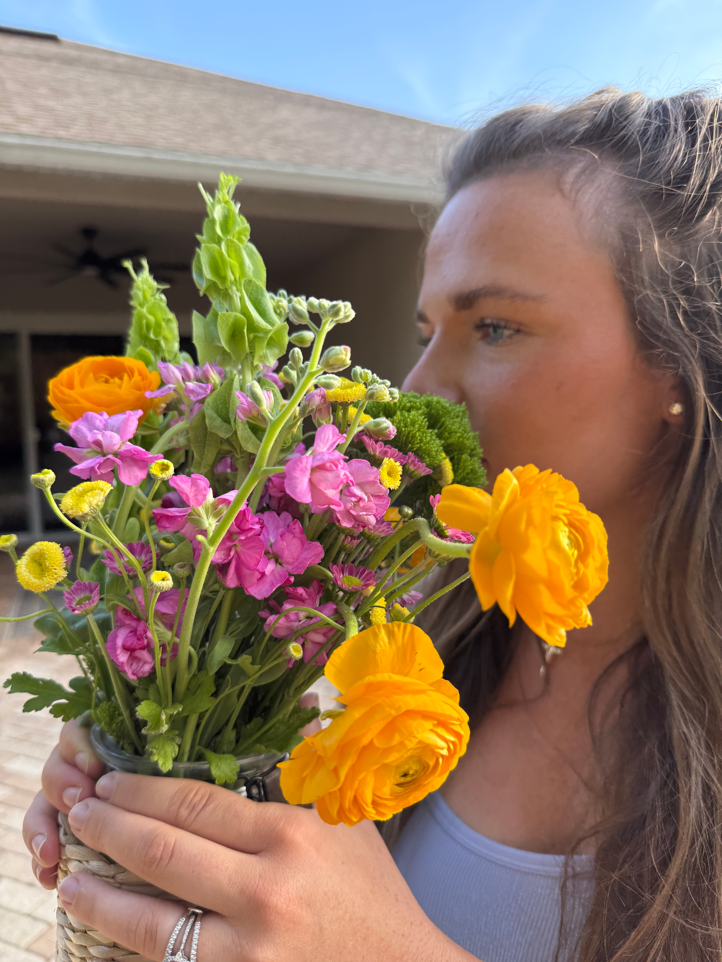 Finnie holding a colorful market bouquet